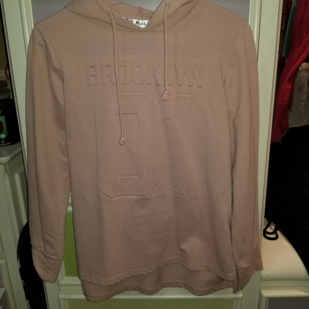 Im selling a creamish pink colored brooklyn sweate